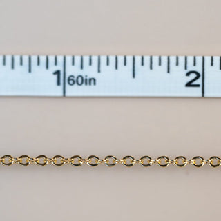 Permanent jewelry chain measured to 2 inches.
