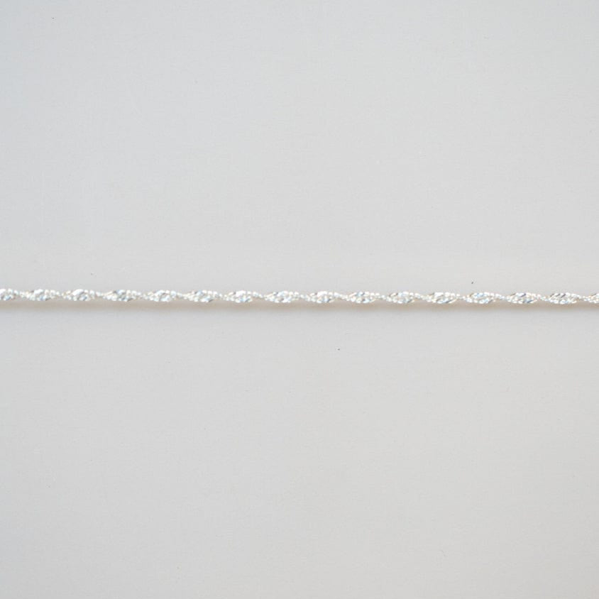Permanent jewelry chain detail.
