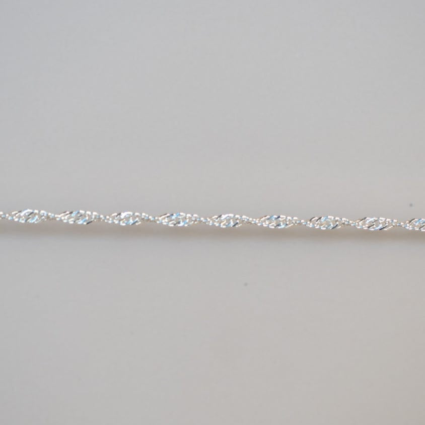 Permanent Jewelry Chain - 40 - Close-up of a delicate silver chain.
