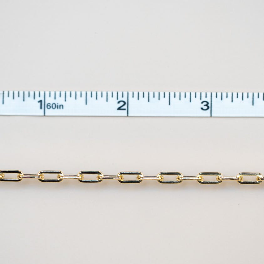 Permanent jewelry chain with ruler showing length.