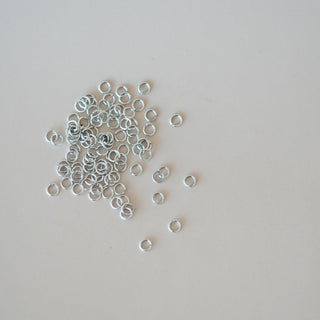 oxidized jump rings  on a white background