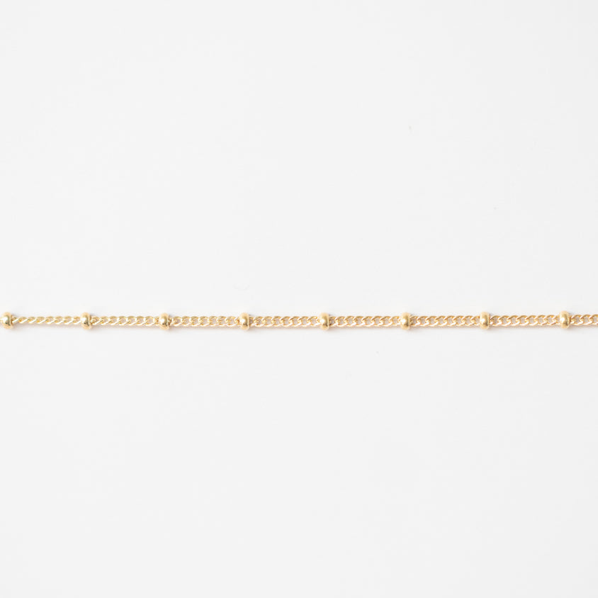 Gold chain on a white background