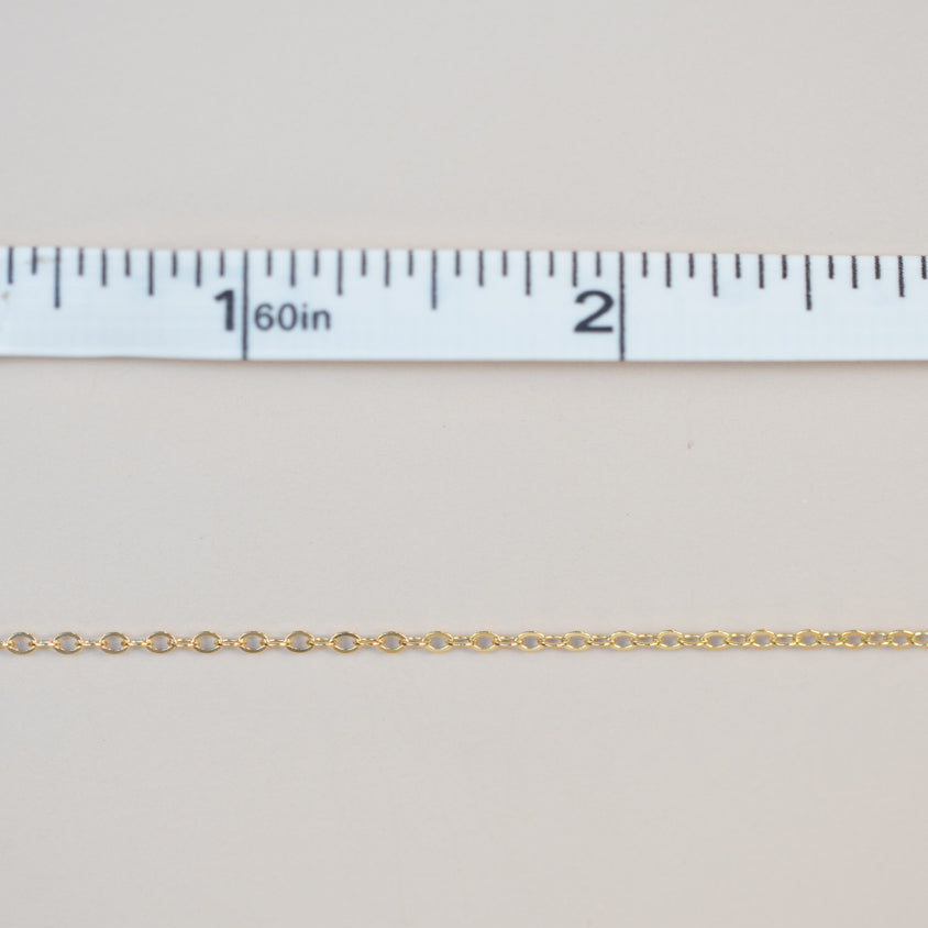 Gold chain measured with ruler