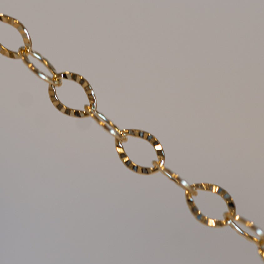 Gold chain necklace detail
