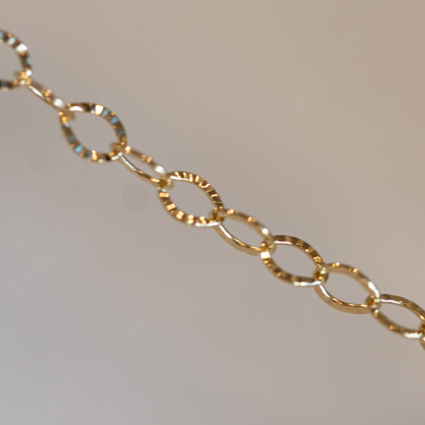 Gold chain necklace detail