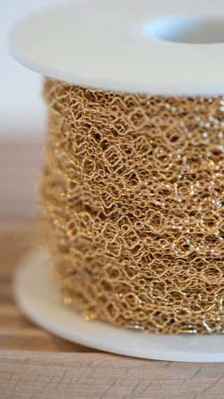 Gold chain on spool - everarc-2966