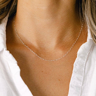 Gold chain necklace on woman