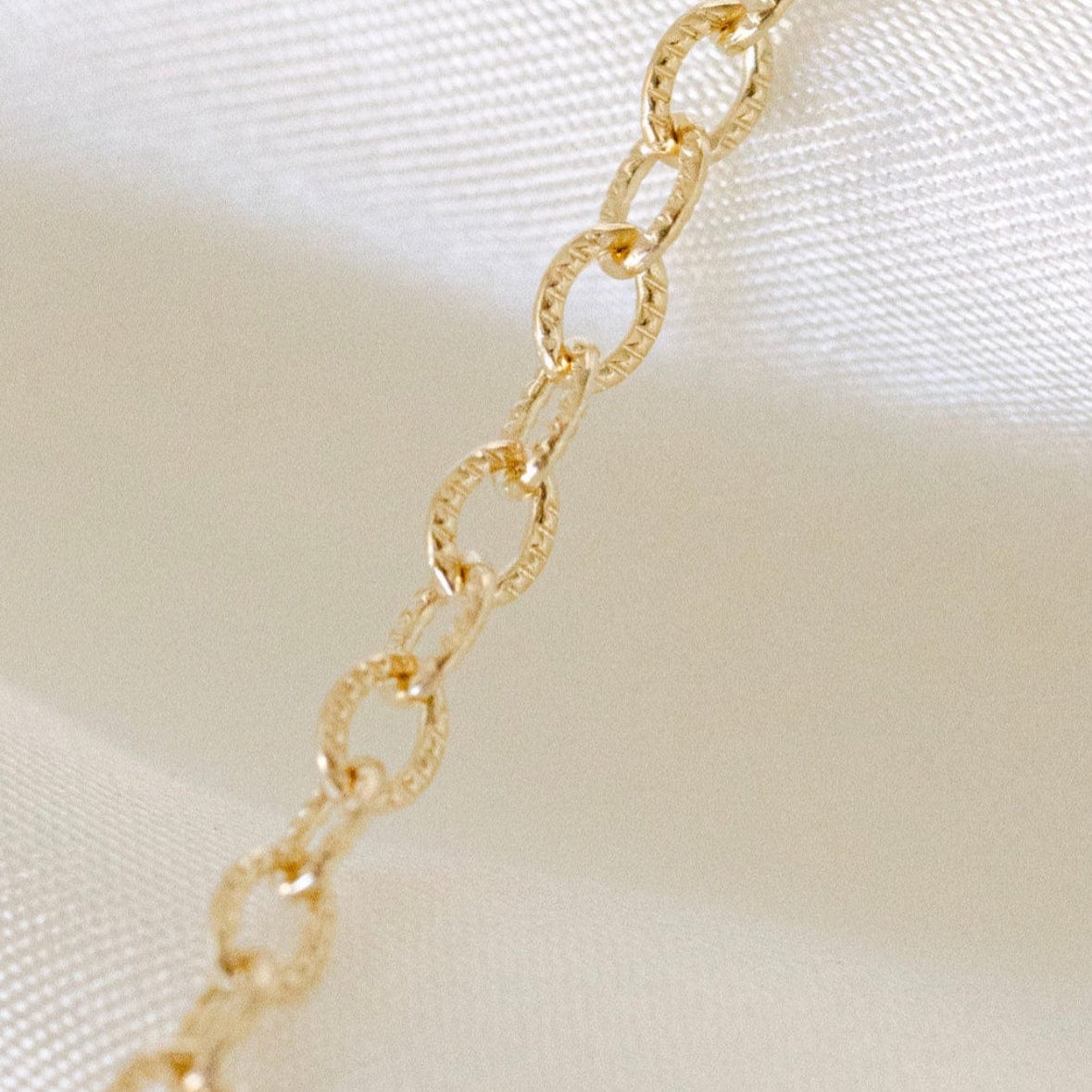 Gold chain necklace detail