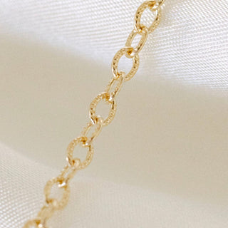 Gold chain necklace detail