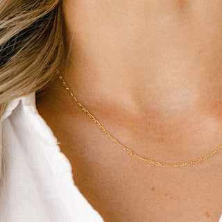 Gold chain necklace on woman