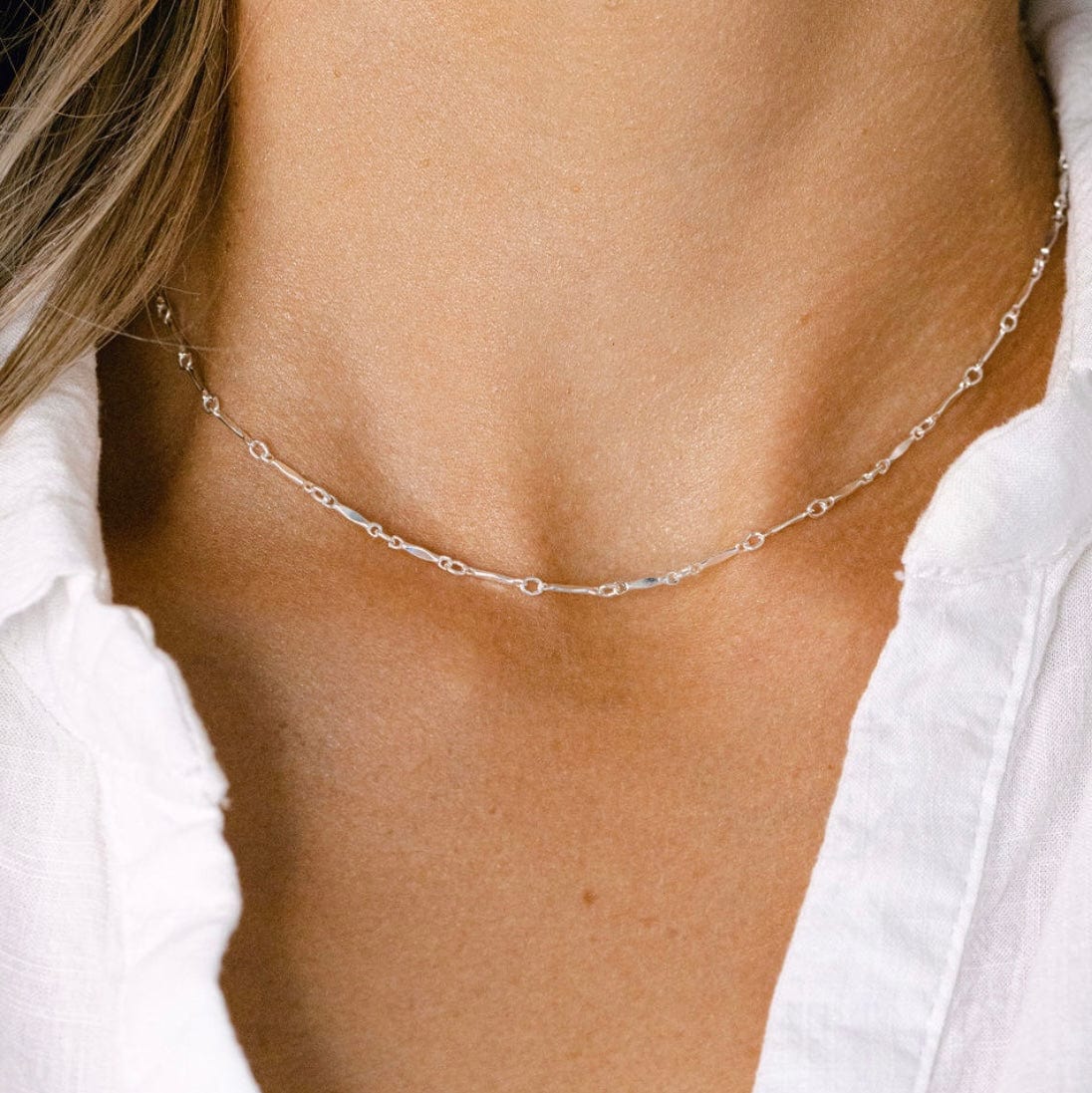 Silver necklace on a woman