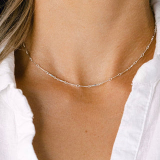 Silver necklace on a woman