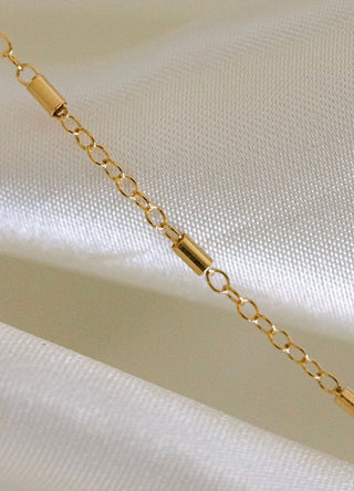 Gold chain necklace detail