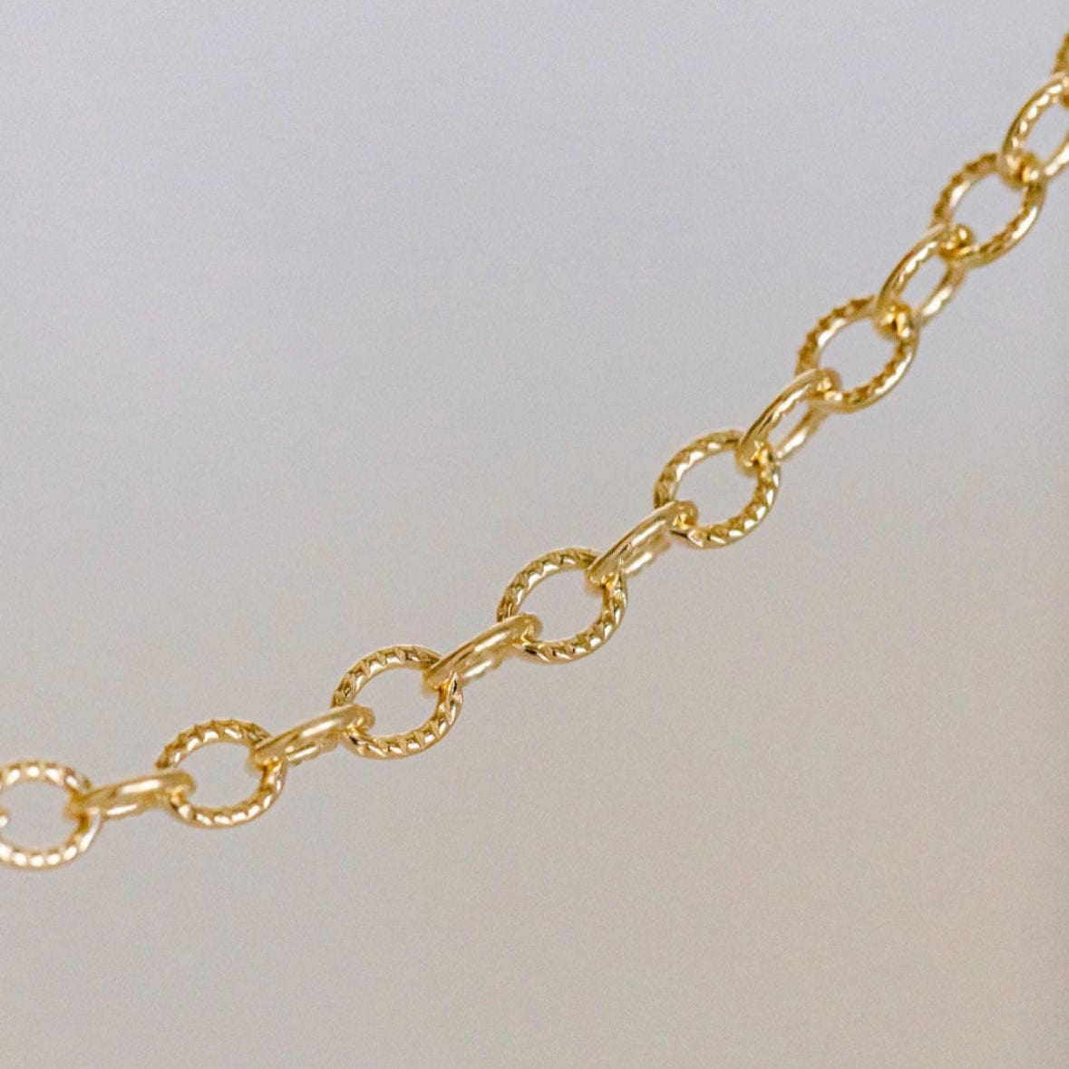 Gold chain necklace detail