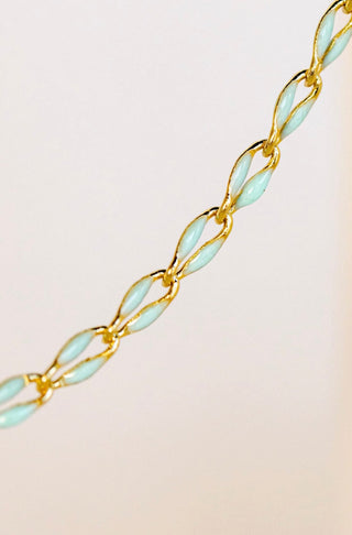 Gold and blue enamel chain necklace detail