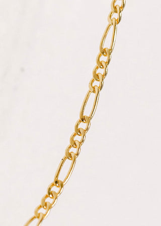 Gold Figaro chain necklace detail