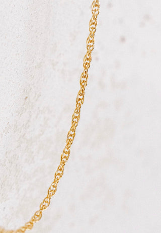 Gold chain necklace detail