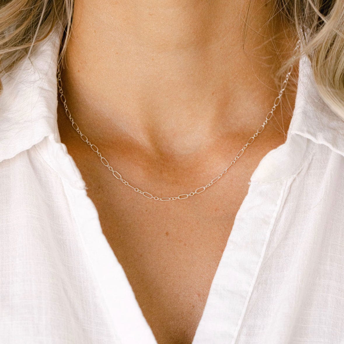 Silver chain necklace on woman