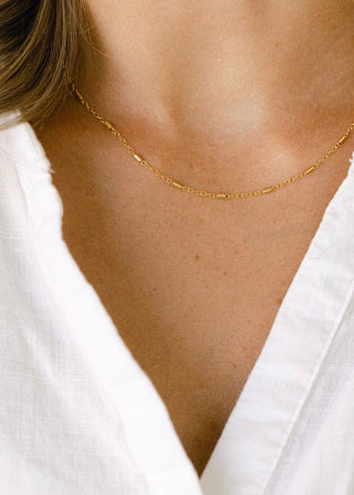 Gold necklace on a woman