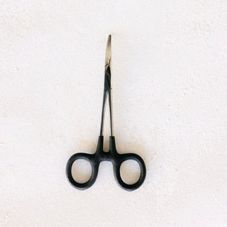 Black surgical forceps on white background