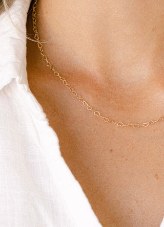 Heart chain necklace on a person