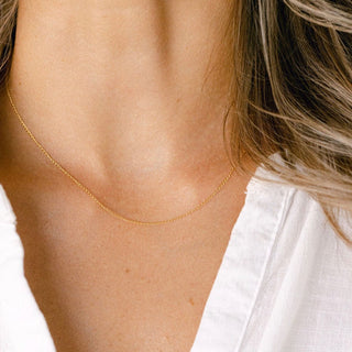Gold chain necklace on woman