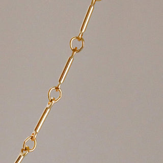Gold chain necklace detail