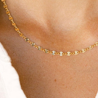 Gold necklace on neckline