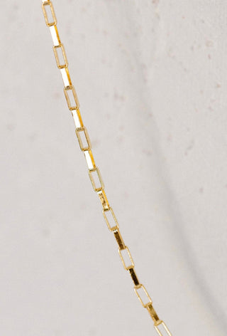 Gold chain necklace detail
