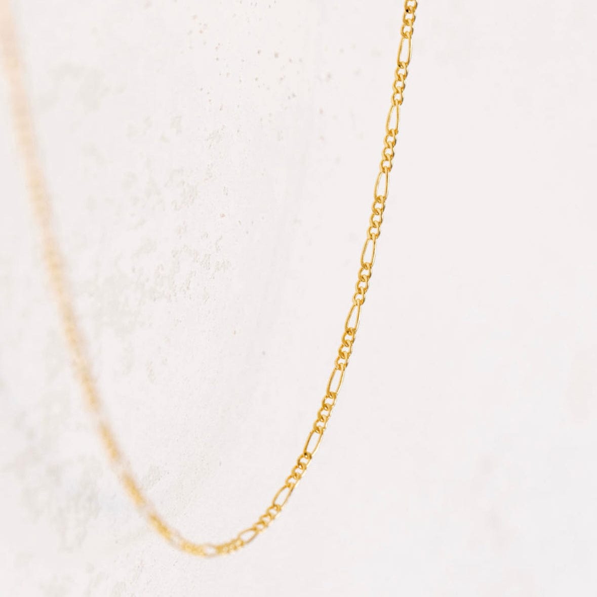 Gold figaro chain necklace