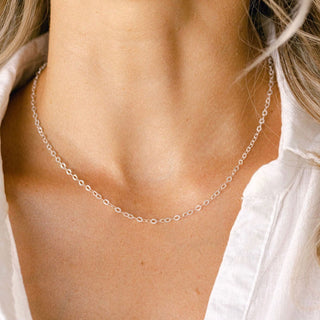 Silver necklace on woman