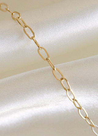 Gold chain necklace detail