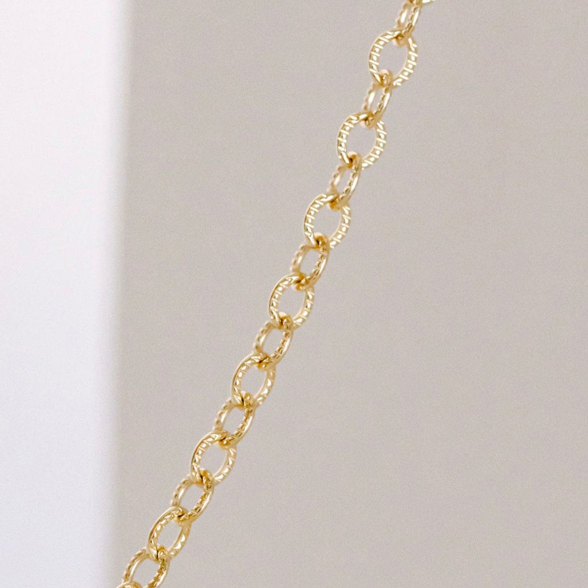 Gold chain necklace detail