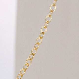 Gold chain necklace detail
