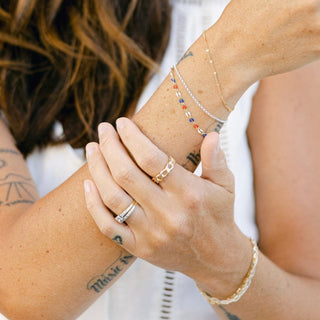Woman's arm with bracelets and rings, image_a152aed7