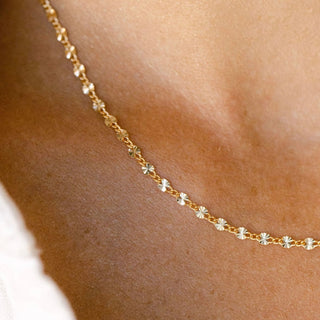 Gold necklace on décolletage