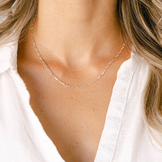 Woman wearing a delicate gold necklace