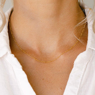 Gold chain necklace on woman