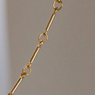 Gold chain necklace detail