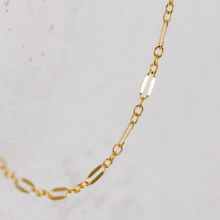 Gold chain necklace detail