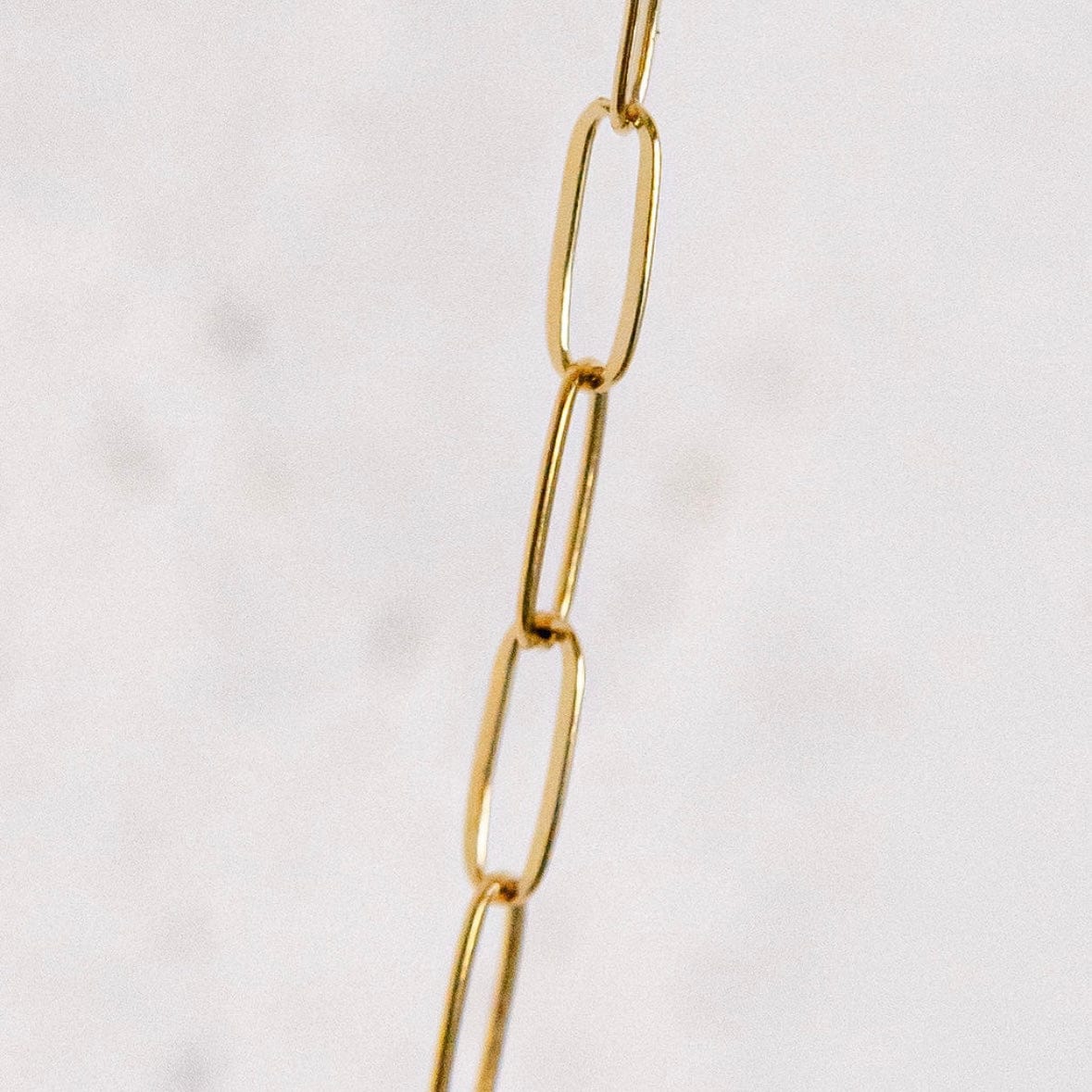 Gold chain necklace detail