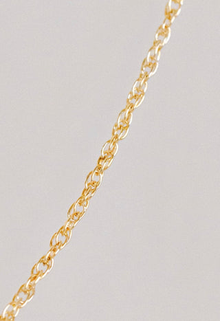 Gold chain necklace detail