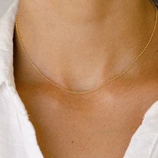 Gold chain necklace on a person, image_f83b4f5d