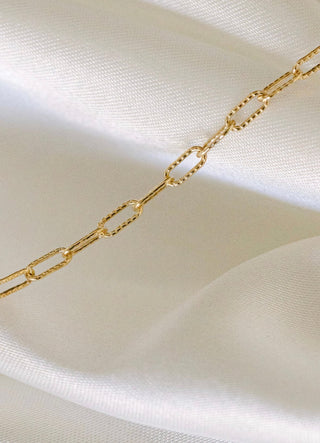 Gold chain necklace detail