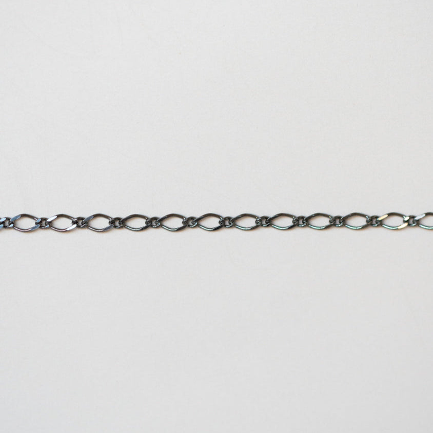 Thin chain on a light gray background