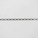 Thin chain on a light gray background