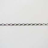 Thin chain on a light gray background