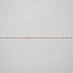 Silver bracelet on a light gray background