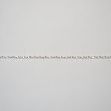 Silver bracelet on a light gray background