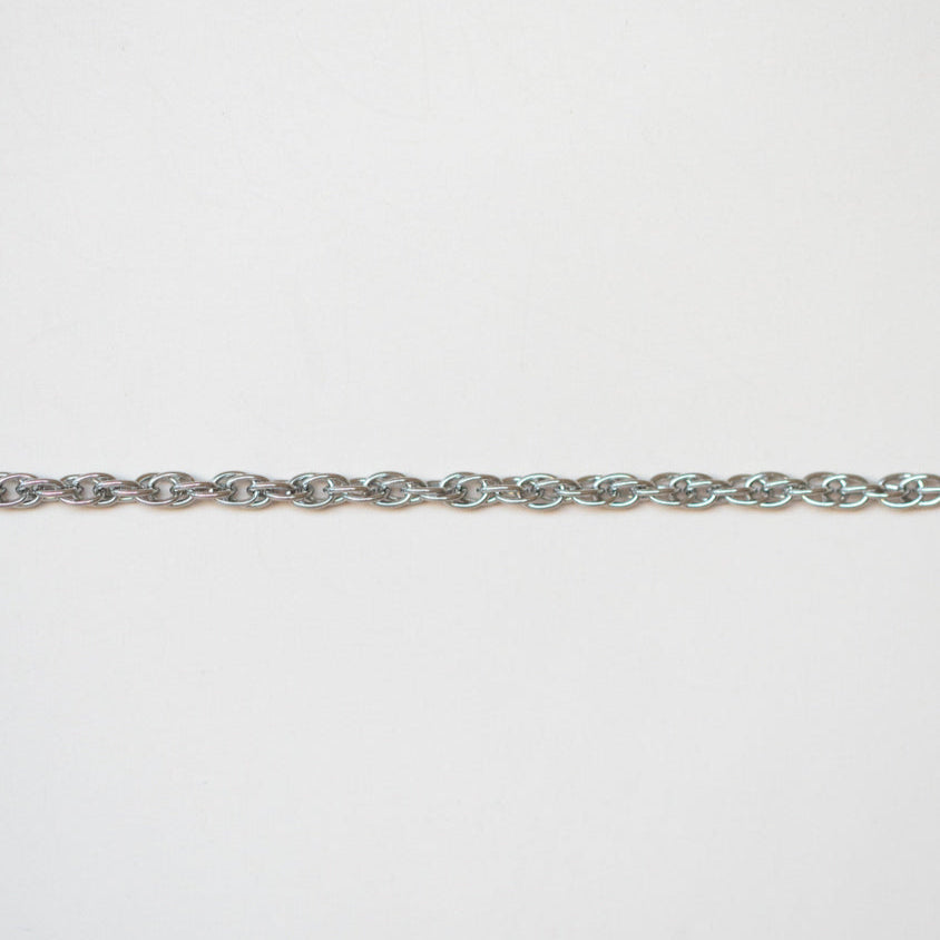 Silver braided chain on a white background